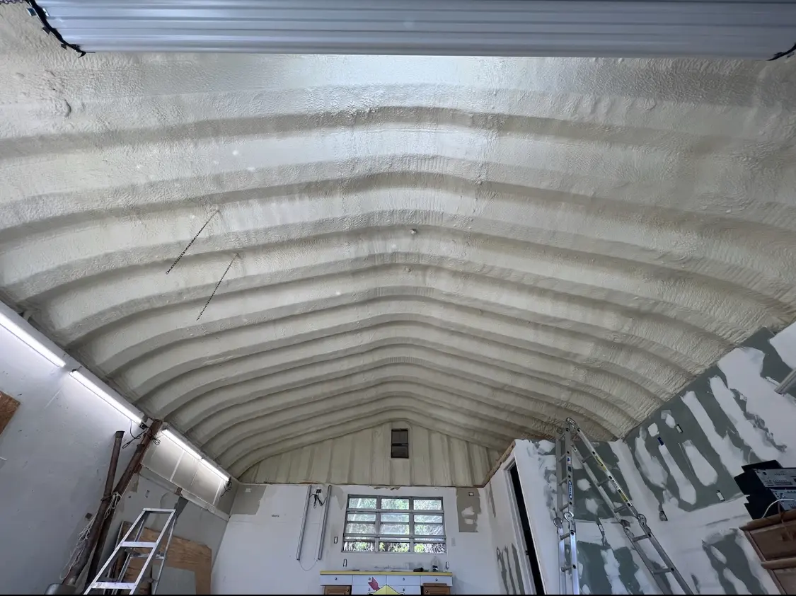 Spray polyurethane foam applied to the underside of a metal roof deck in Hannibal